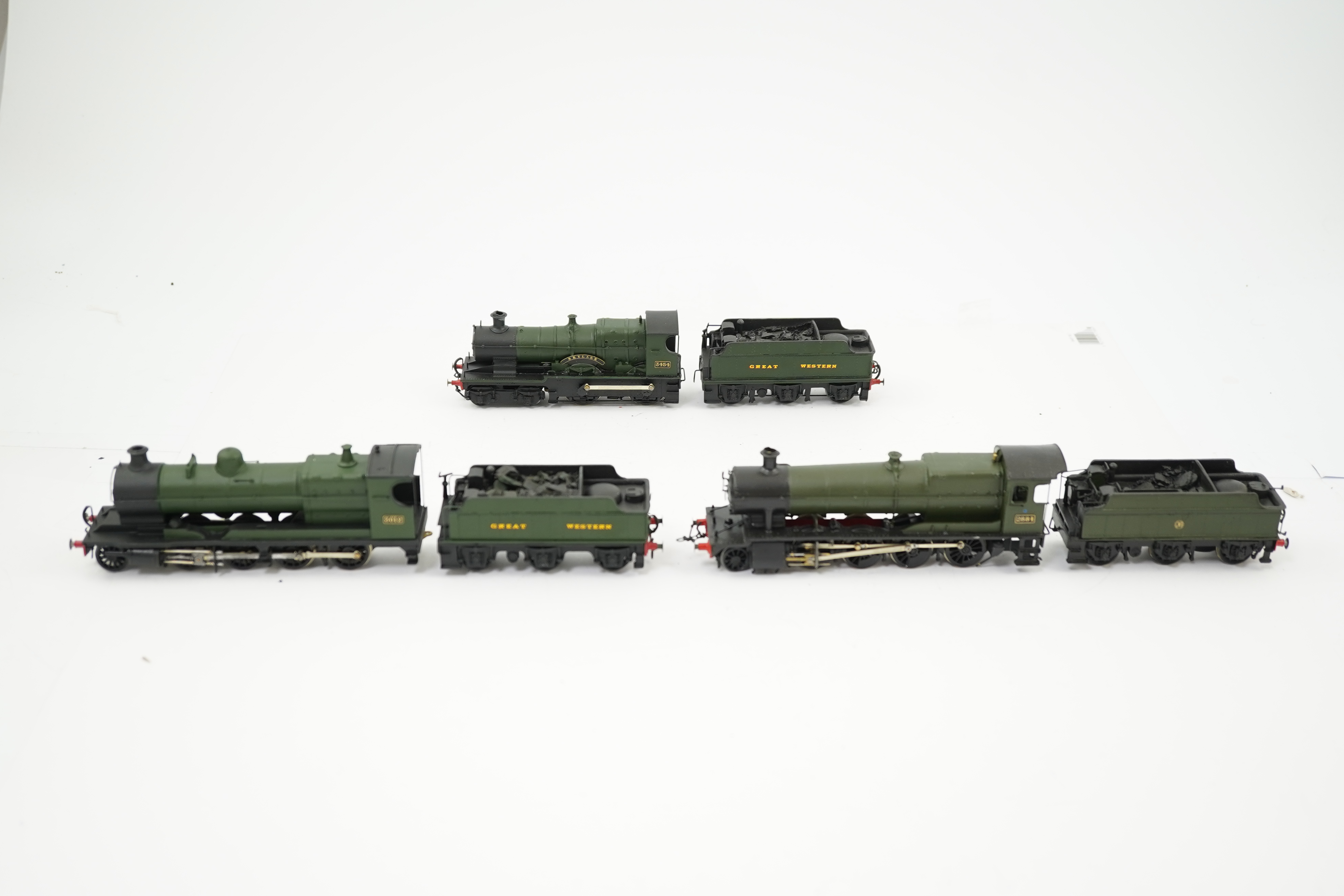 Three 00 gauge brass and white metal kit built GWR tender locomotives; a 2884 class 2-8-0, 2884, together with an 33xx class 4-4-0, 3454, and a War Dept. 2-8-0, 3012, all constructed, painted and lined to a high standard